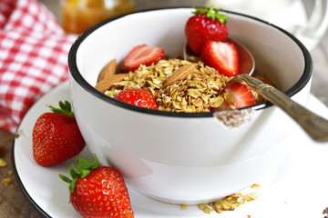 Granola with fresh strawberry - healthy breakfast.
