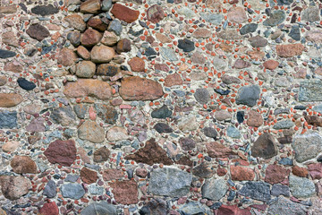 The old wall with stones and bricks background