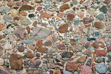 The old wall with stones and bricks background