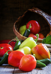 Bell pepper, tomatoes and chili peppers on old wooden style, rus