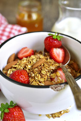 Granola with fresh strawberry - healthy breakfast.