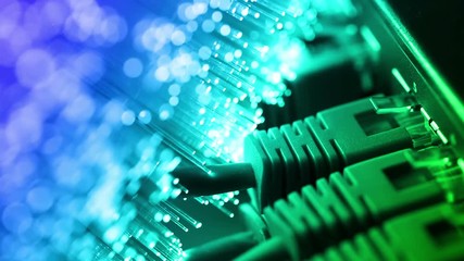 Ethernet cable and server with Fiber optics background, shot in HD