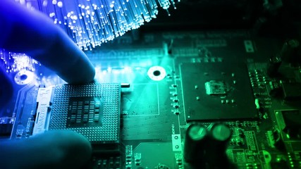 cpu and motherboard  with Fiber optics background, shot in HD