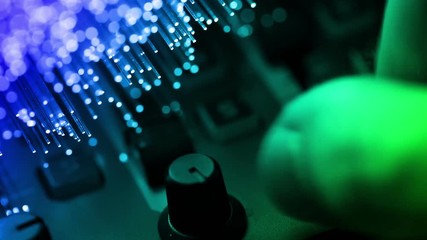 Disc jockey playing music on modern midi controller