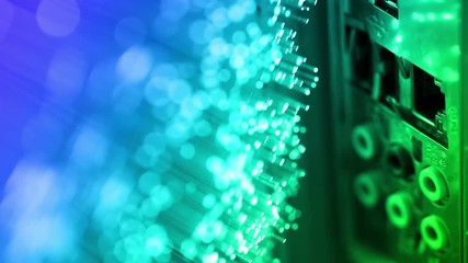 human plugging in and out Ethernet cable, with Fiber optics backgrounds, shot in HD