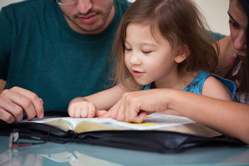 Family Reading the Bible Together