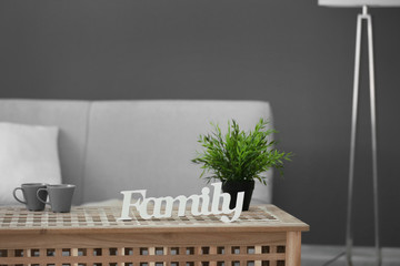 Word Family on wooden table in room