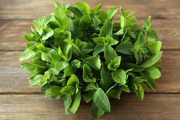 Bunch of green mint on wooden background