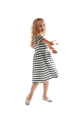 Fototapeta premium Cheerful little girl dancing on white background