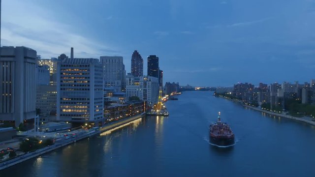 NEW YORK - Circa July, 2016 - A unique evening aerial view of the East River as seen from the Roosevelt Island Tramway.  	