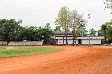 Red running tracks in sport stadium
