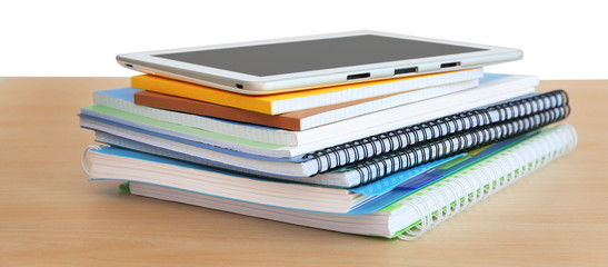 School notebooks and tablet, closeup