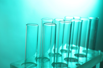 Test tubes on turquoise background