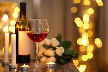 Romantic composition with wine on blurred background
