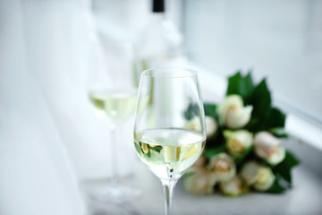 Gentle composition of romantic date with wine and flowers