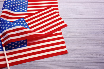Obraz premium American flags on white wooden background
