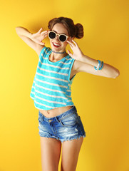 Beautiful girl on yellow background