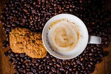 Cup of coffee with whole grains cookies