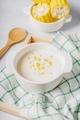 hot corn soup in a white bowl