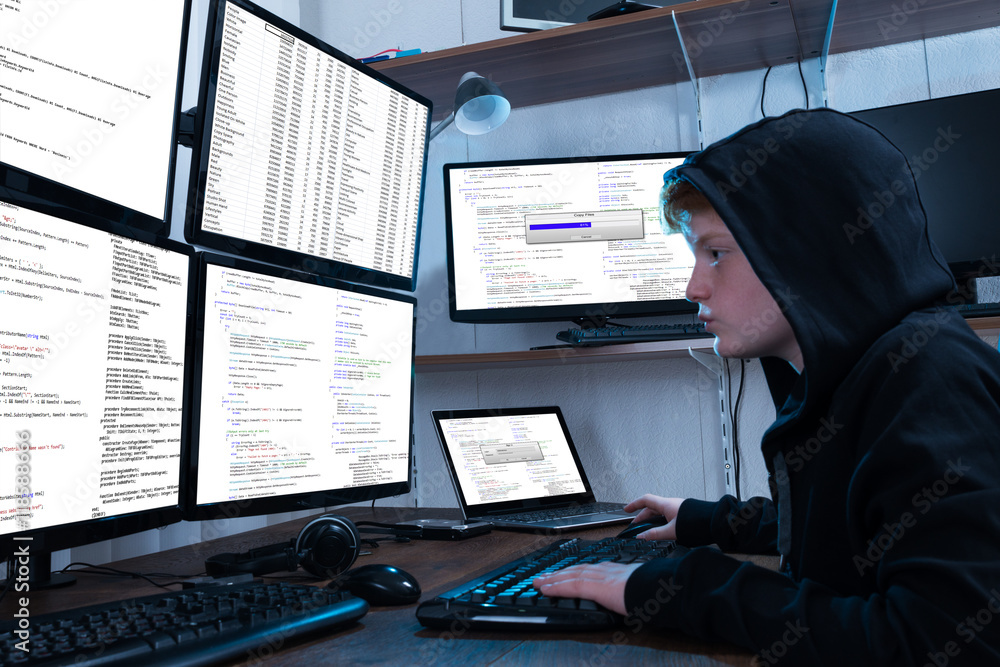 Aufkleber Boy Programming On Computer With Multiple Monitors
