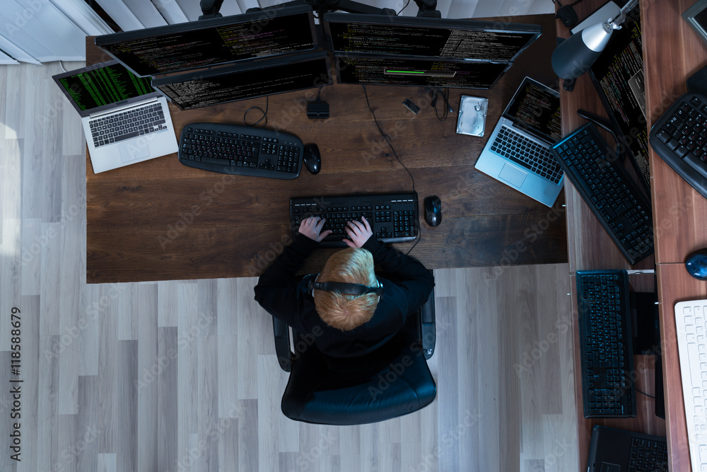 Poster Boy Working On Multiple Computers