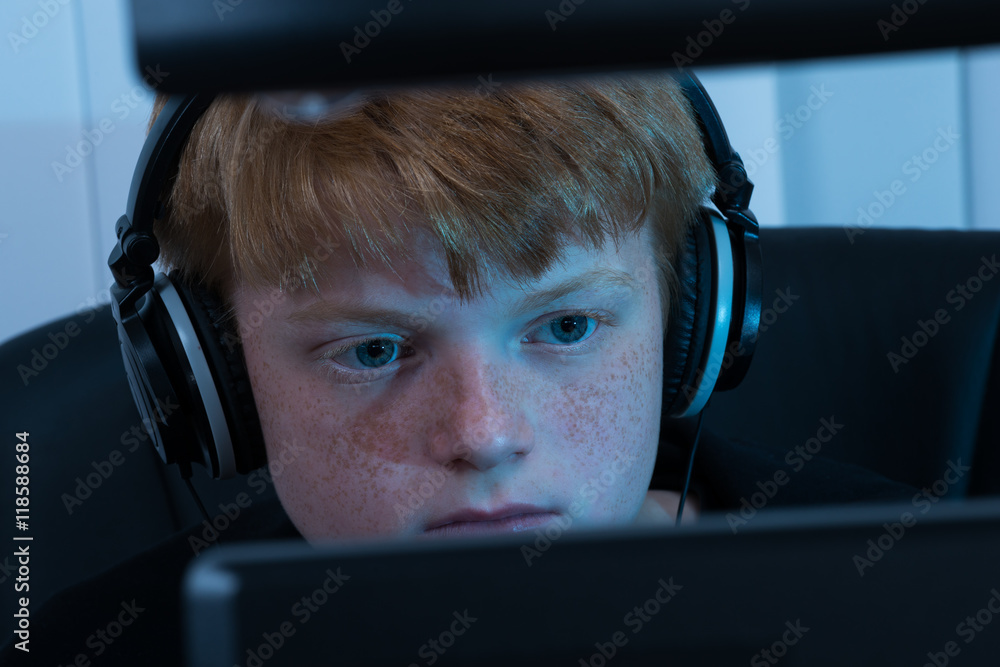 Poster boy working on computer