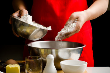 Preparation bread cooking,pouring the flour in the bowl