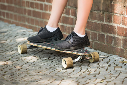 Boy's Feet On Skateboard