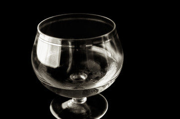 Shot glass with alcohol in monochrome execution.
