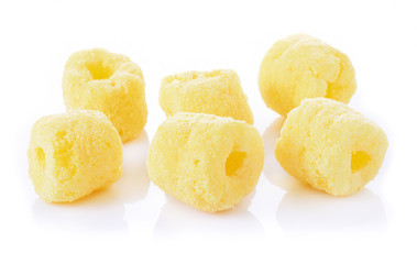 Crunchy corn snacks on a white background
