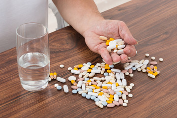 Person's Hand Holding Pills