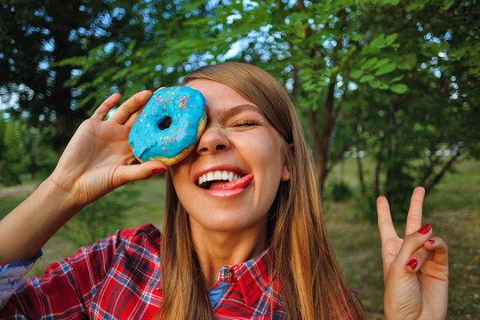 Cheerful girl and a donut
