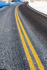 Yellow strips on road close-up, dividing line