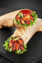 Burrito with grilled chicken and vegetables (fajitas, pita bread