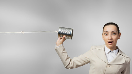 Woman using deaf phone . Mixed media