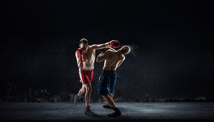 Obraz na płótnie Canvas Box fighters trainning outdoor . Mixed media