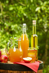 Apples and apple preserves on a barrel on the background of the