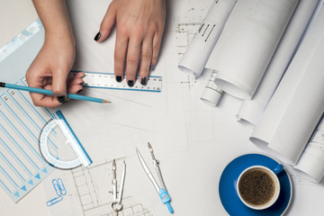 Architect working on blueprint.