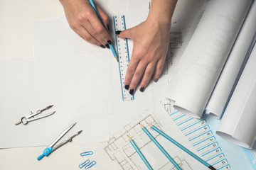 Architect working on blueprint.