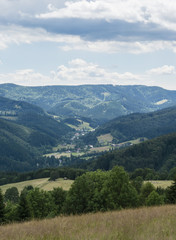 Fototapeta na wymiar Mountain landscape with the town in the valley.