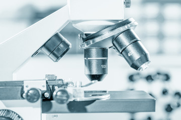Microscope and model of molecule in laboratory