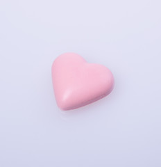 chocolate in pink colour or love shape chocolate.