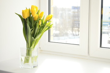 Yellow tulips in vase