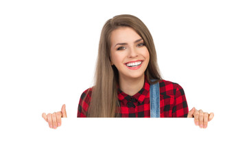 Smiling Girl In Lumberjack Shirt Behind White Placard