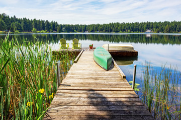 Naklejka premium Waterfront lake with small pier. Perfect water view