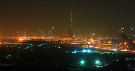 Fototapeta premium A night panoramic view of the Dubai downtown with various lights and structures