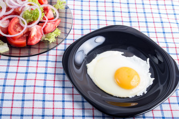 Homemade breakfast of fried egg and vegetables