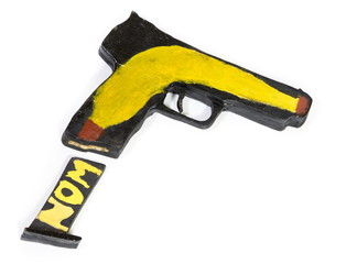 Wooden model of gun on white background