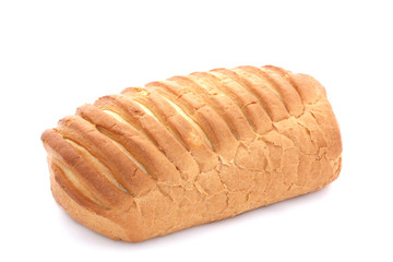 Baton of wheat bread on a white background