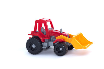 The toy tractor on a white background